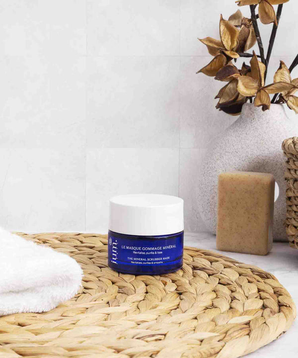 ium paris organic exfoliating mask in luminous bathroom with beige accessories