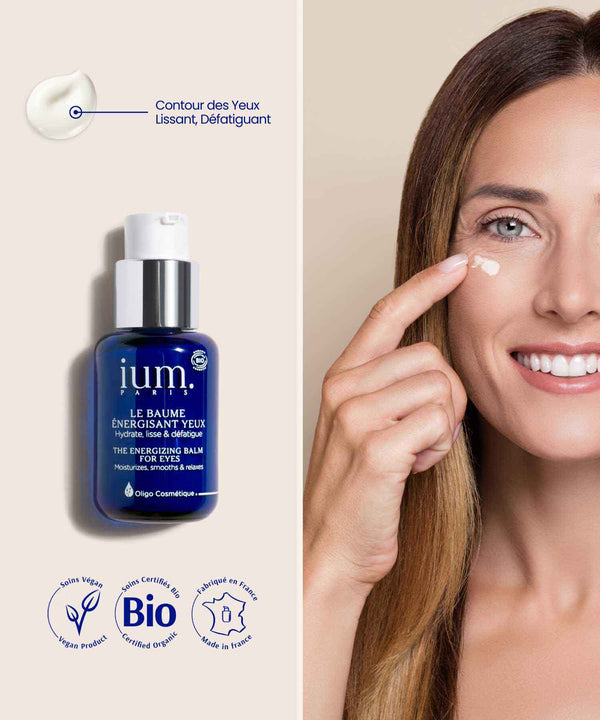 Application of IUM Paris Energizing Eye Balm, a certified organic treatment to smooth, moisturize and revitalize the eye contour area.