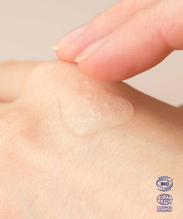 zoom on the texture of the ium cleansing gel applied to a woman's hand