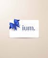 White ium gift card on beige background