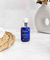 Falcon blue eye balm ium in luminous bathroom with beige accessories